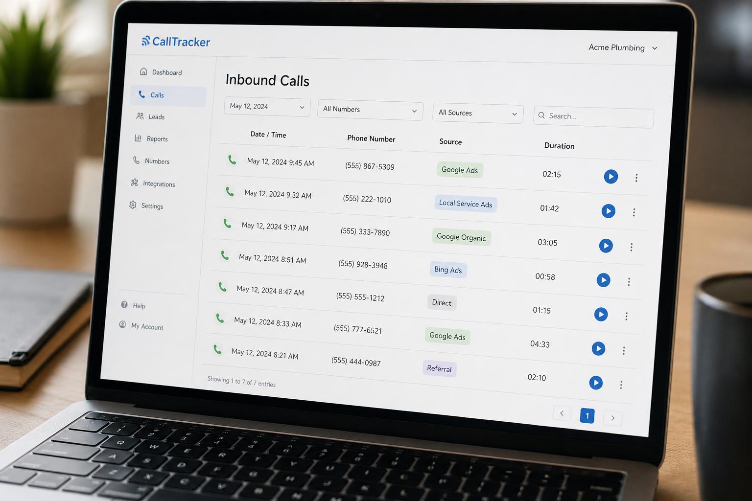 A close-up of a laptop screen showing a call tracking dashboard with a list of inbound phone calls, source labels, and call duration next to each entry